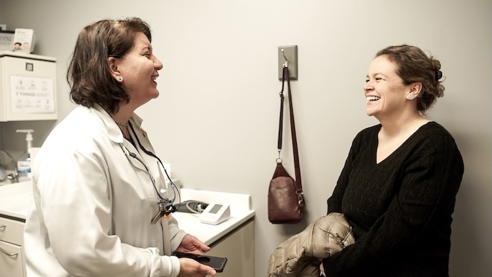 Dr. Shaibani interacting with a patient.