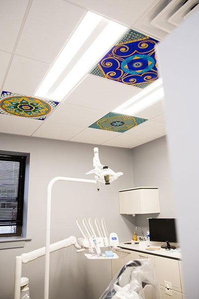 Colorful ceiling in one of our operatories