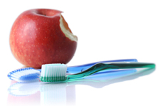 Image of an apple and tooth brush.